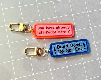 Kudos and Dead Dove 2.5" Pink and Blue Acrylic Charm Keychains (Choose One)