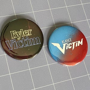 Ship Victim 2.25" Pin-Back Buttons (Choose One)