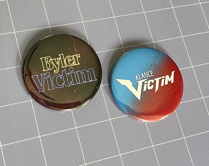 Ship Victim 2.25" Pin-Back Buttons (Choose One)