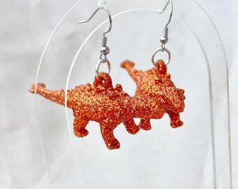 Orange Glitter Anklyosaurus Earrings