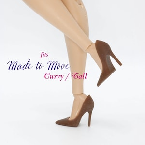 May include: Brown high-heeled shoes for a Made to Move Barbie doll. The shoes are labeled "fits Made to Move Curry/Tall".