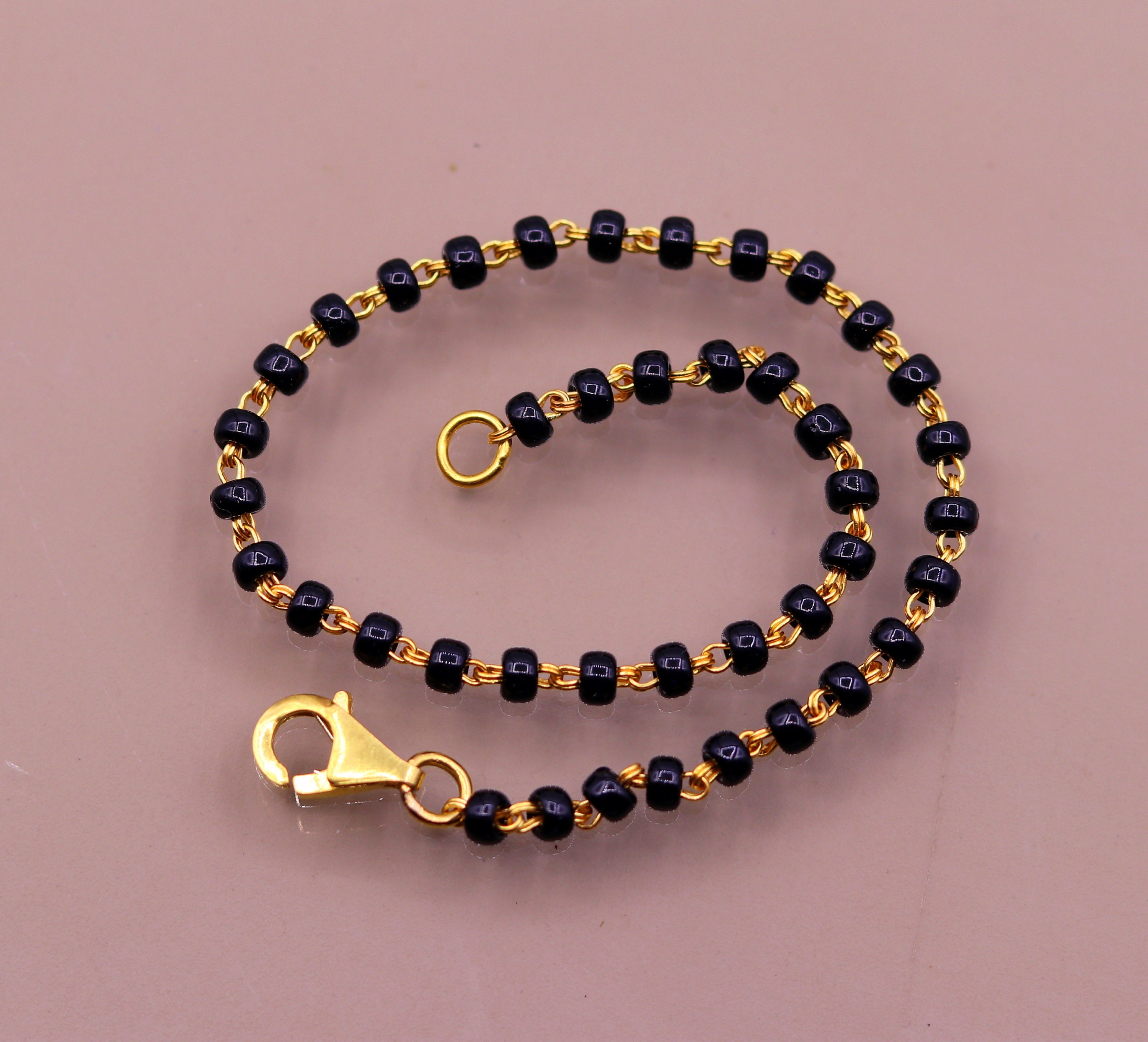 Gold and shop black beads bracelet