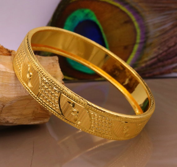 Tiffany Knot Double Row Hinged Bangle in Yellow Gold with Diamonds |  Tiffany & Co.