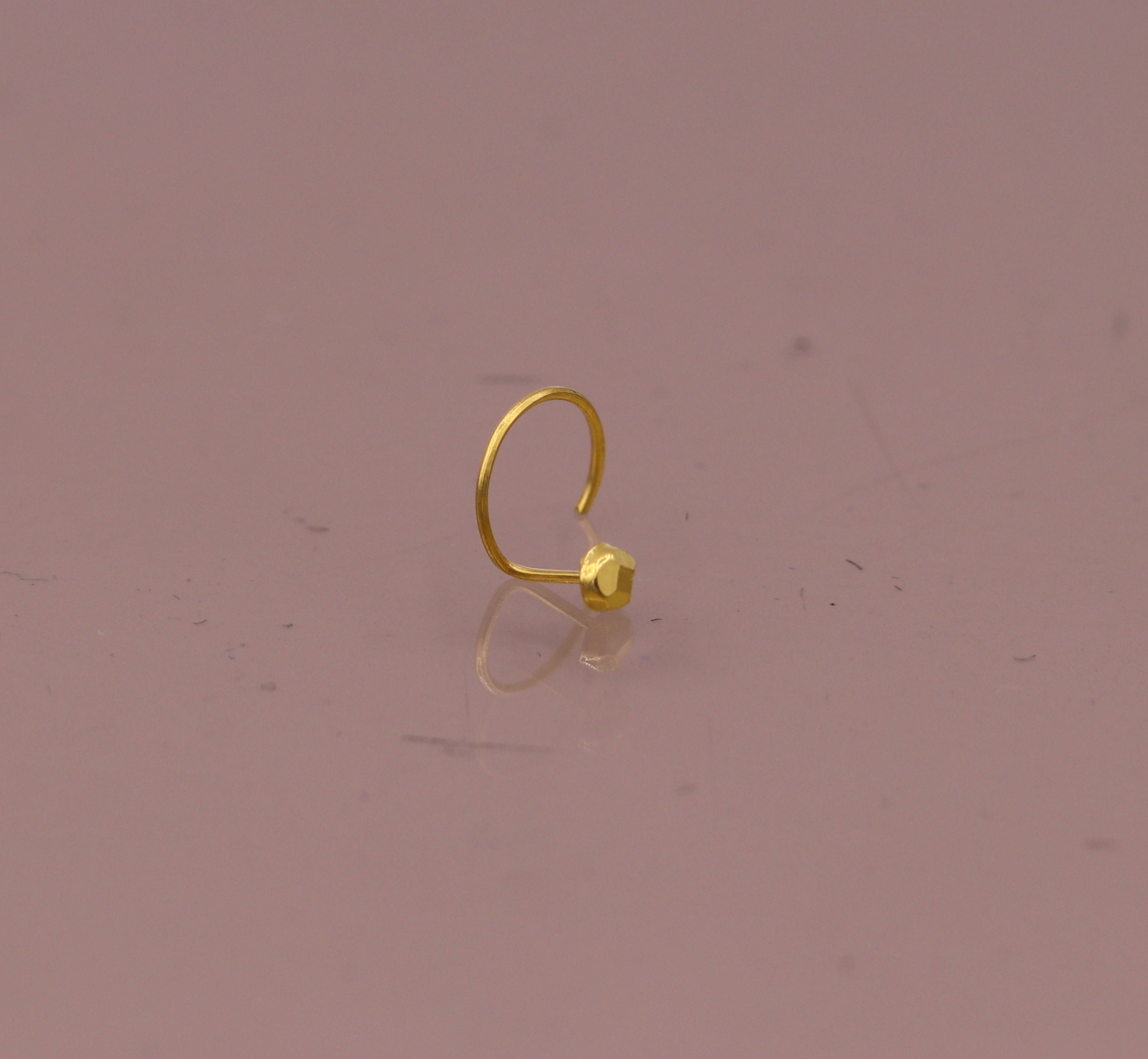 Small gold shop nose pin design