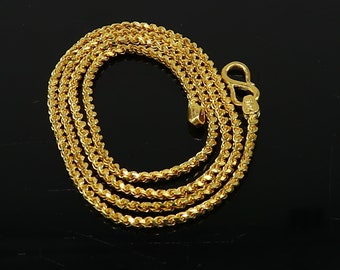 May include: A gold chain necklace with a rope chain design. The chain is approximately 20 inches long and has a lobster clasp.