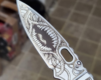 Laser Etched "Creeping Madness" stainless steel folding knife original design (Prototype 1)
