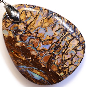 60.30 Carats Drilled Boulder Opal Pendant