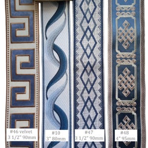 May include: Four decorative fabric ribbons with various patterns. Designs include a Greek key, a flowing wave, diamond shapes, and a geometric knot. Measurements are provided in inches and millimeters.