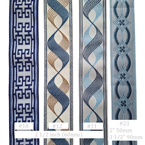 May include: A selection of decorative ribbons in various designs and colors. The ribbons include geometric patterns, swirling designs, and embroidered details. Measurements are provided in inches and millimeters.