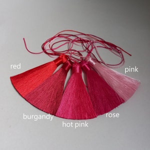 decorative tassels of pink and red