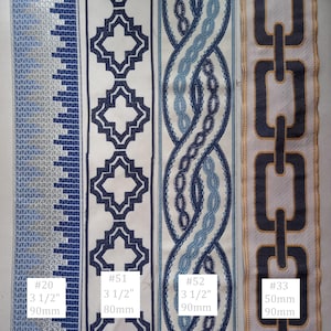 May include: Close-up of four decorative ribbons with various patterns. Designs include geometric shapes, chain links, and interwoven patterns in shades of blue and white. Measurements are provided in inches and millimeters.