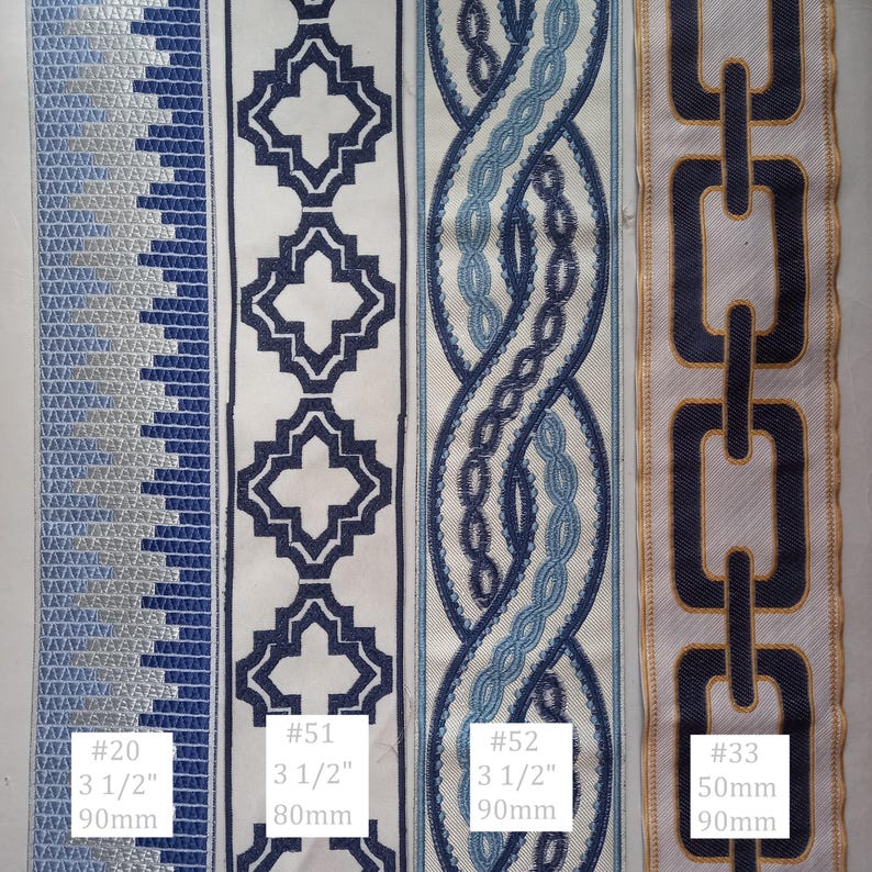 May include: Close-up of four decorative ribbons with various patterns. Designs include geometric shapes, chain links, and interwoven patterns in shades of blue and white. Measurements are provided in inches and millimeters.