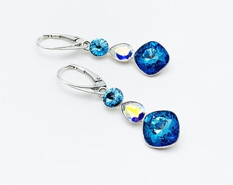 Earrings stones in blue and transparent Swarovski crystal, bermuda blue, aurora borealis crystal, on silver sleepers 925