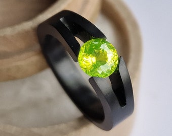 Black Zirconium tension ring with round brilliant cut gemstone. Handmade and customizable.