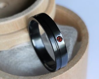 Black zirconium band with flush set stone. Two tone finish. Handmade and customizable.