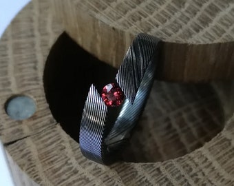 Unique handmade Stainless damascus steel tension ring with round brilliant cut stone setting.