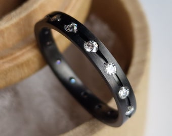 Black zirconium band with flush set gemstones. Minimalist stacking ring. Handmade and customizable.