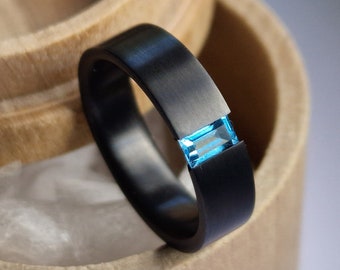 Black zirconium tension ring with diamond cut Stone setting. Brushed finish. Handmade and customizable.