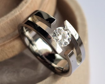 Titanium tension ring with round brilliant cut gemstone setting. Polished finish. Handmade and customizable.