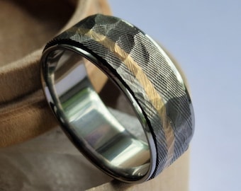 Stainless Damascus Steel, 18ct Gold and titanium spinner ring with faceted outer surface. Handmade and customizable.