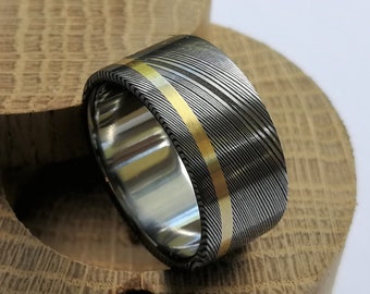 Stainless damascus steel ring with solid gold channel and titanium lining. Handmade and customizable.