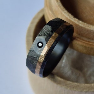 Black zirconium ring with solid gold channel and flush set black diamond/clear moissanite. Brushed finish. Handmade and customizable.