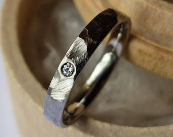 Faceted titanium band with flush set gemstone. Minimalist stacking ring. Handmade and customizable.