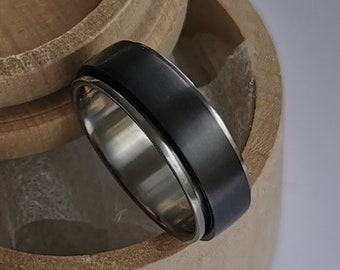 Black zirconium and titanium spinner ring. Handmade and customizable.