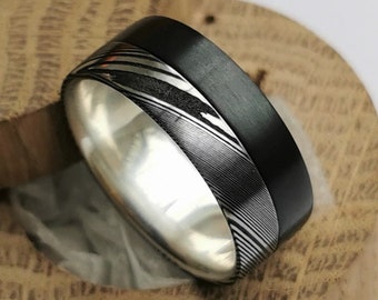 Brushed zirconium and Stainless Damascus steel band with sterling silver / solid gold inner lining. Handmade and customizable.