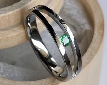 Titanium tension ring with round brilliant cut gemstone setting. Polished finish. Handmade and customizable.