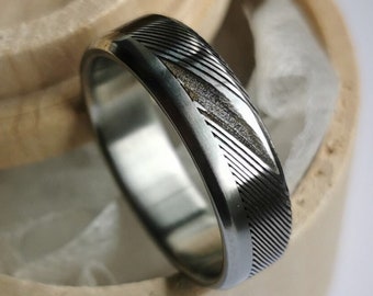 Bevelled stainless damascus steel and titanium ring. Handmade and customizable.