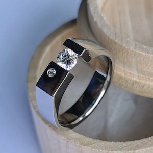 Titanium tension ring. Unique handmade polished tension ring with round brilliant cut gemstone setting. polished finish.