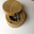Handmade women's titanium band with turquoise inlay. Handcrafted. product logo