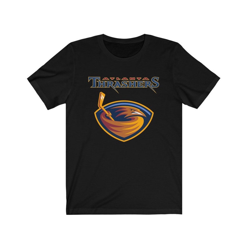 May include: Black t-shirt with a graphic of the Atlanta Thrashers NHL team logo. The logo features a red, orange, and yellow bird with a hockey stick in its beak, set against a blue and gold shield.