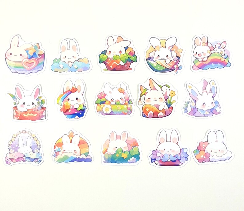 May include: A set of 12 colorful stickers featuring cute cartoon bunnies in various poses. The stickers are decorated with rainbows, flowers, and hearts.