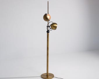 Staande lamp van Reggiani uit de jaren 70, messingkleurig, met twee verstelbare bolvormige koppen.