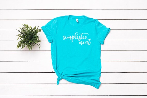 Bella Canvas 3001 Teal T-Shirt Mockup Flat Lay Bella Canvas 3001 Teal T-Shirt Mockup Flat Lay