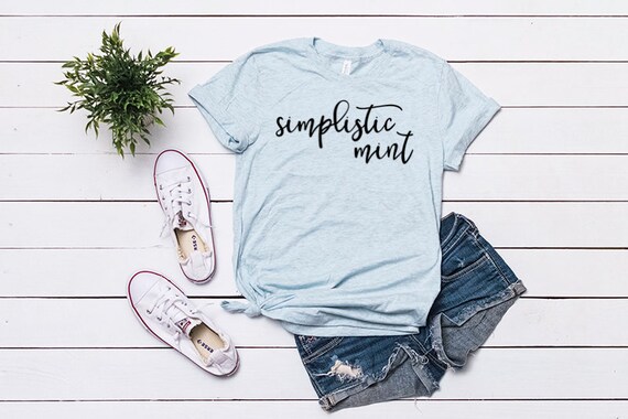Bella Canvas 3001 Mockup Styled Flat Lay Bella Canvas Heather Prism Ice Blue Shirt Mockup Tied T Shirt Mockup Hanging T Shirt Mockup