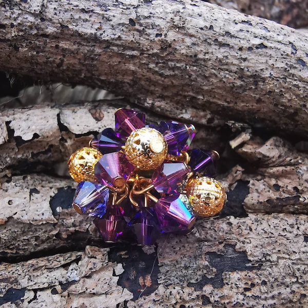 Handcrafted crystal cluster ring with adjustable band in rich  shades of velvety purple and gold filagree metal beads.