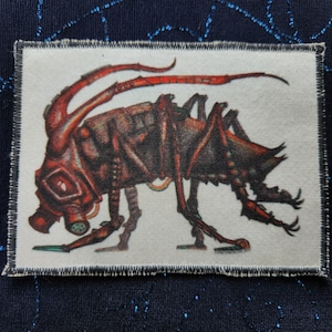 May include: A brown and black insect with a gas mask and long legs. The insect is on a white background.