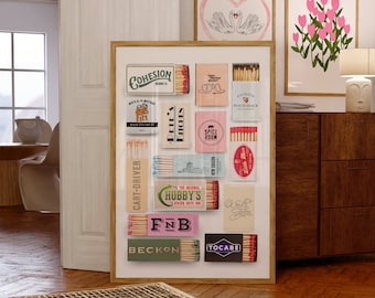 May include: A framed collage of vintage matchbox labels with various designs and text, including "Cohesion Brewing Co.", "Bulls Busy", "Palisade Peach Shack", "Spice Room", "Cart-Driver", "The Original Hubby's Burger Bar", "F&B", "Beckon", "Little Man", "Vollo Tailor", and "Tocabe".