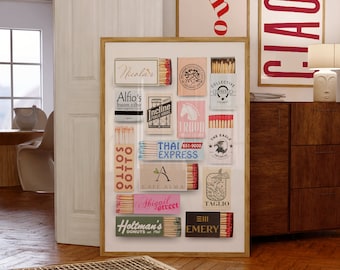 May include: A framed collage of vintage matchbox labels with various designs and text, including "Nicolas", "Alfio's buon cibo", "Incline", "Thai Express", "Cafe Alma", "Sbiggieet", "Holtman's Donuts", "Taglio", and "EIII Emery".