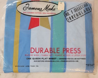 May include: A blue and white striped sheet with the text "Famous Make" and "Durable Press" printed on it. The sheet is labeled as a "No. 1 Selection" of "Irregulars" and is made of 50% combed cotton and 50% polyester. The sheet is designed for a 60 x 80 inch mattress and has a finished size of 90 x 109 inches.