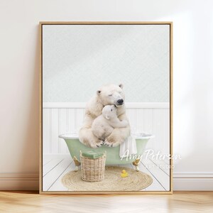 A polar bear and a baby bear sitting together in a bathtub, with a basket of toys nearby.
