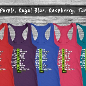 May include: Five racerback vests in red, purple, royal blue, raspberry, and turquoise. Each vest displays a vertical list of words such as "Motivated", "Stronger", and "Grateful". The text "#ME" is at the bottom of each vest.