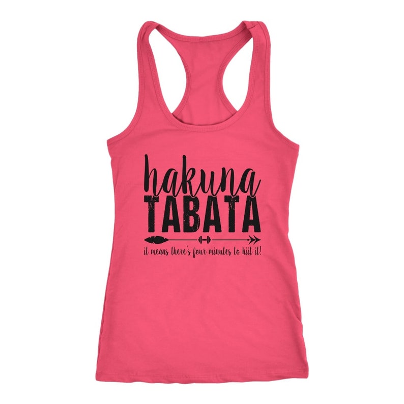 May include: A pink racerback tank top with the words "hakuna TABATA" in black script and block letters. Below the text is an arrow with a feather and dumbbell graphic, and the phrase "it means there's four minutes to HIIT it!"