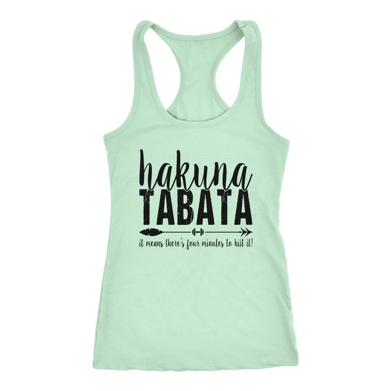 May include: A light green racerback tank top with the words "hakuna TABATA" in black script. Below the text is an arrow with a barbell and the phrase "it means there's four minutes to hiit it!"