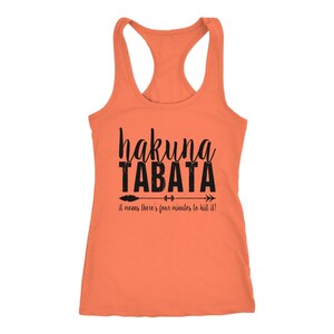 May include: Orange racerback tank top with the words "hakuna TABATA" in black script and block letters. Below the text is an arrow with weights and the phrase "it means there's four minutes to HIIT it!"
