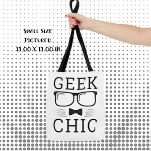 May include: White tote bag with black straps and the text "GEEK CHIC" in black letters. The text is accompanied by a graphic of a pair of glasses and a bow tie.