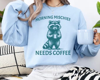 Morning Mischief Raccoon Coffee Sweatshirt: Funny Trash Panda Tee